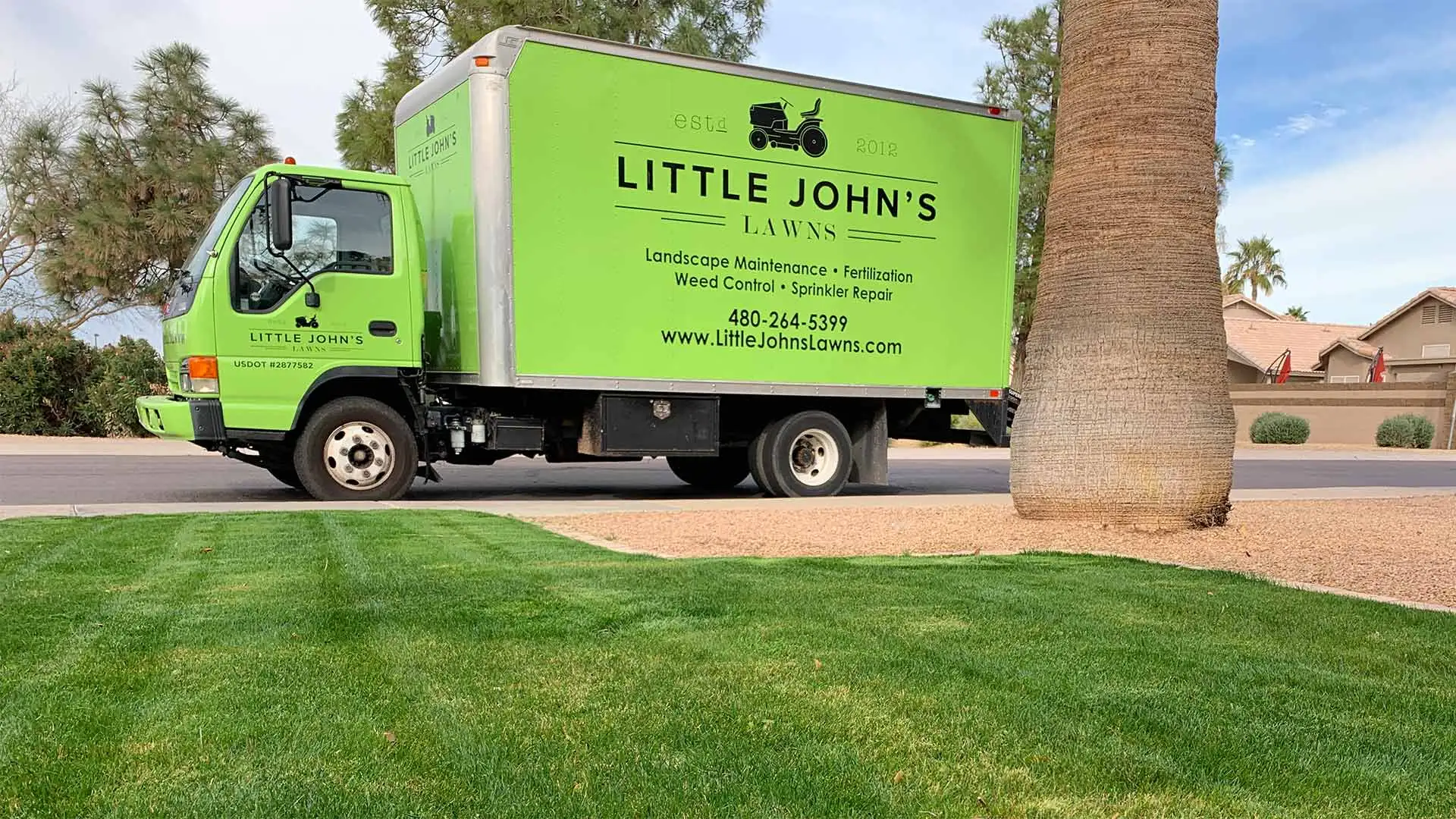Landscape maintenance work truck at a property in Mesa, AZ.