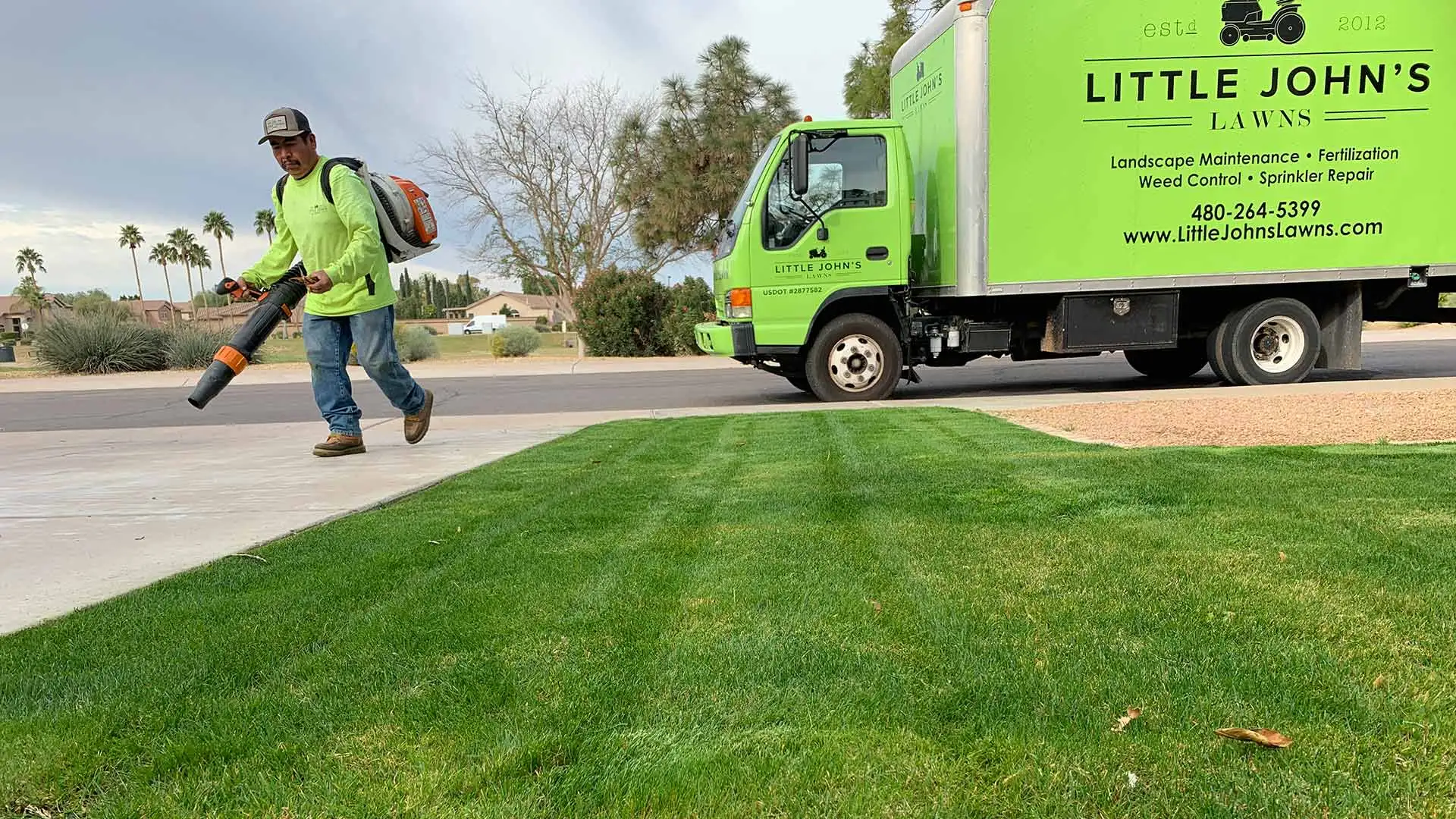 Little John's Lawns worker providing services at a home in Chandler, AZ.