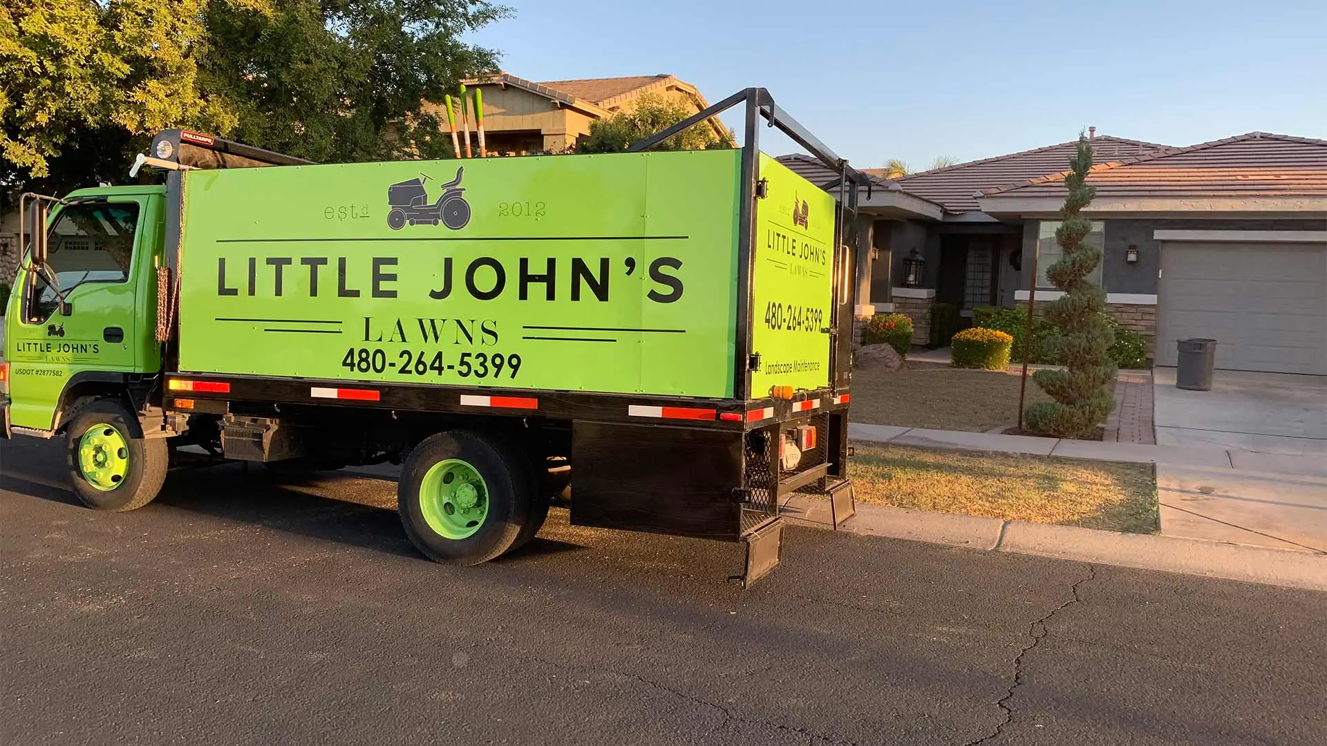 Little John's Lawns work truck at a home in Gilbert, AZ.