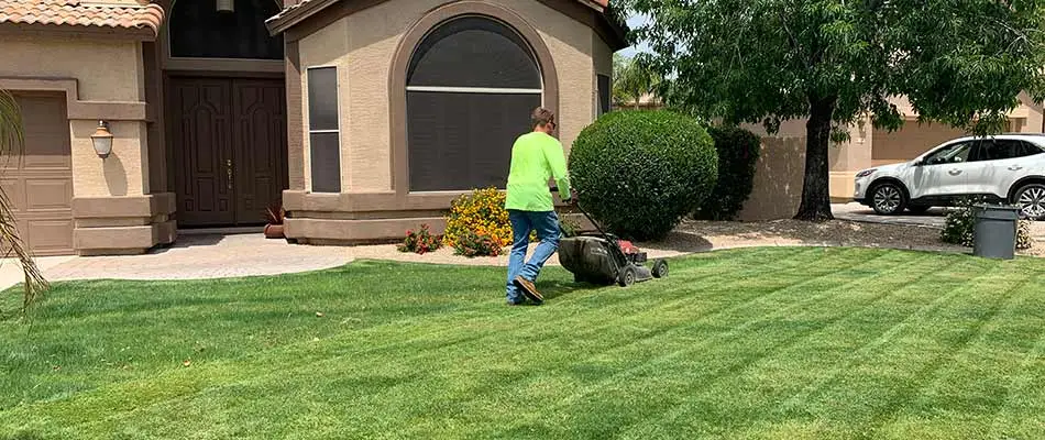 Lawn mowing service at a home in Queen Creek, Arizona.