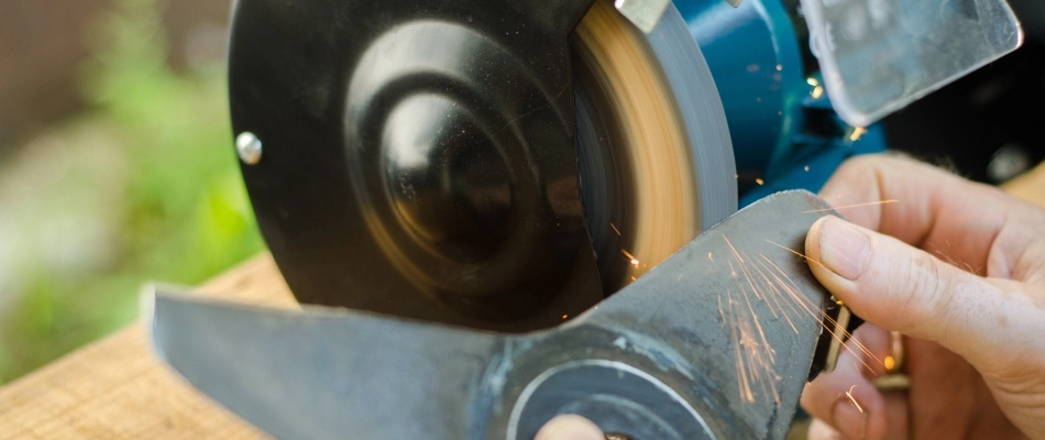 Professional sharpening mower blade in Mesa, AZ.